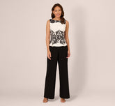 Sleeveless Peplum Jumpsuit With Scroll Lace Details In Ivory Black