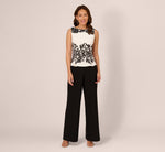 Sleeveless Peplum Jumpsuit With Scroll Lace Details In Ivory Black 2