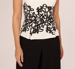 Sleeveless Peplum Jumpsuit With Scroll Lace Details In Ivory Black 3