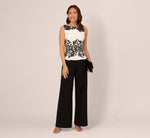 Sleeveless Peplum Jumpsuit With Scroll Lace Details In Ivory Black 1